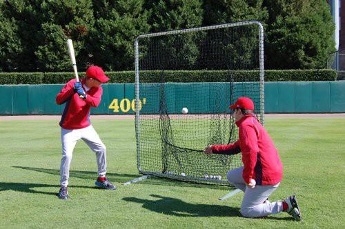 The batter sets hid distance from the fence by placing the knob of the bat against his belly, and the barrel end touching the net or tee.