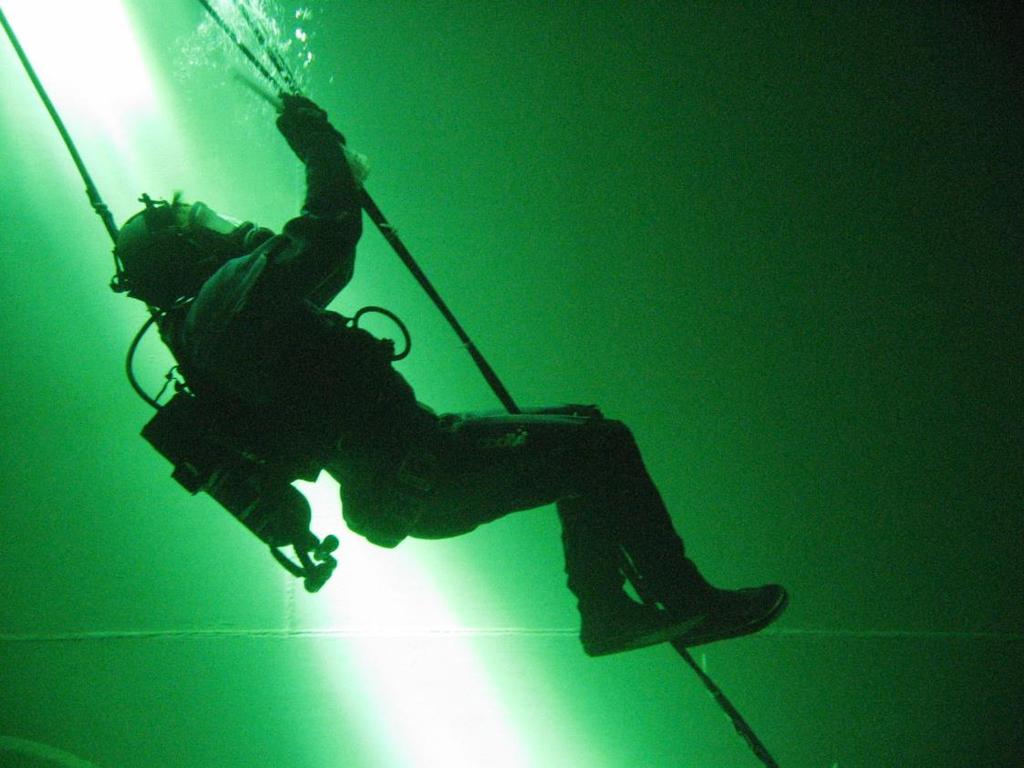 Figure 4: Diver secures the control tables to the stainless steel guide wire using zip ties.