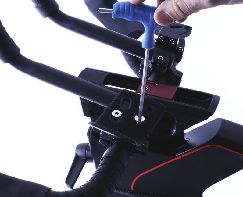 Tighten anti-clockwise securely using the spanner. 3a. Take the Tri-bar assembly and insert the two ends into the Tri-bar clamps with device holder out in front of the bike. 3b.