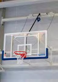 Wall-mounted up-folding basketball backstops Approved Level 2 The unit consists of a wall-frame, two heavy-duty hinged support yokes and an official 180x105 cm 12 mm glass backboard with a blue,
