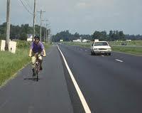 According to the Federal Highway Administration (1994), bicycle lanes are appropriate on roadways having daily volumes that exceed 10,000 or car speeds that exceed 30 mph.