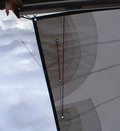 Tie the end of the reefing line onto the end of the boom so that it