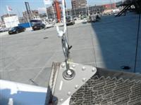 When you reach the top of the mast the ring slides over the mainsail lock and you should be able to hear a click.