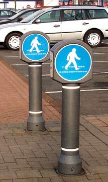 Millsone ENSIGN Bollars wih peesrian crossing sign. Black ENSIGN Bollar wih Keep Lef sign. Aircraf Grey ENSIGN Bollars wih personalise sign.