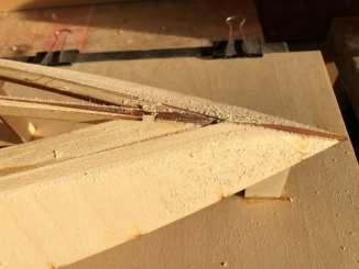 Make this mark on the edge, so that you know how far to glue the sheeting. Note that the bottom sheets have the position of the strakes marked on one side. This side must face outside the hull.