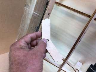 Glue in the engine rails with 30 minute epoxy or Titebond III. Bulkhead 5 must be 90 degrees to the building jig. Use the engine rails to establish this.