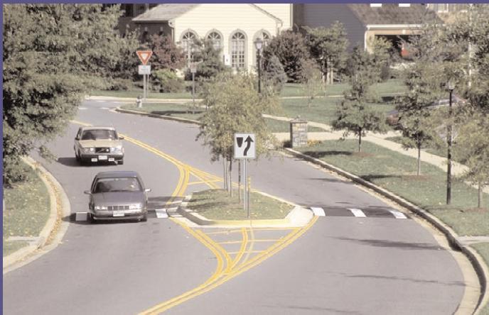 Median Islands 1) Raised island in the center of the roadway with one-way traffic on each side. 2) Application: Used on wide streets to narrow each direction of travel.