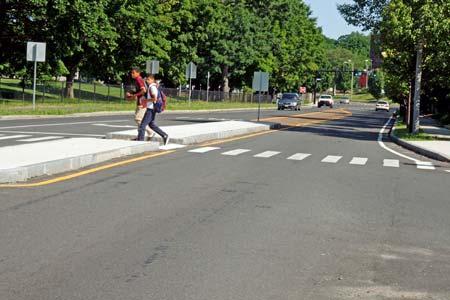 Pedestrian refuges provide the benefits of road narrowing and enhance pedestrian safety.