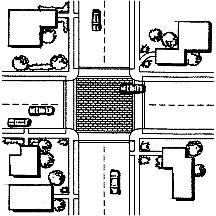 By modifying the level of the intersection, the crosswalks are more readily perceived by motorists to be pedestrian territory.