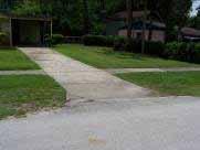Driveway #8 Recommendation: Construct a concrete driveway apron with the addition of a 5-foot sidewalk located 4-feet from the edge of pavement.