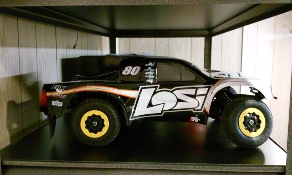 The R/C car was an idea for my birthday to keep me busy on those days when it is too windy to fly. It is an 1/8 scale Losi stadium truck with a brushless motor, cooling fan, and a Spektrum radio.