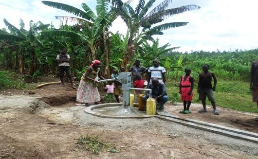 The community collects safe water from the new water