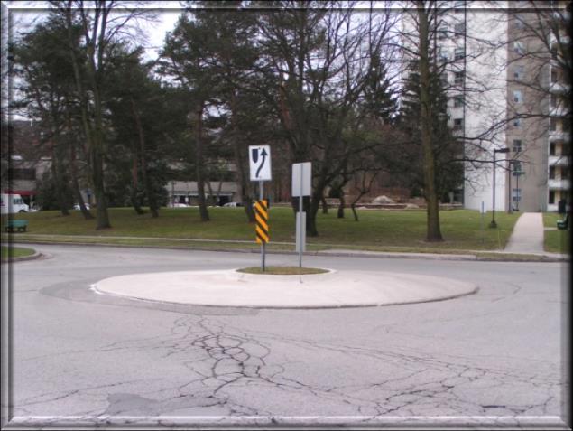 Neighbourhood Traffic Circle City of London Traffic Calming Program Neighbourhood traffic circles are raised islands placed in intersections, forcing traffic to circulate around the raised island.