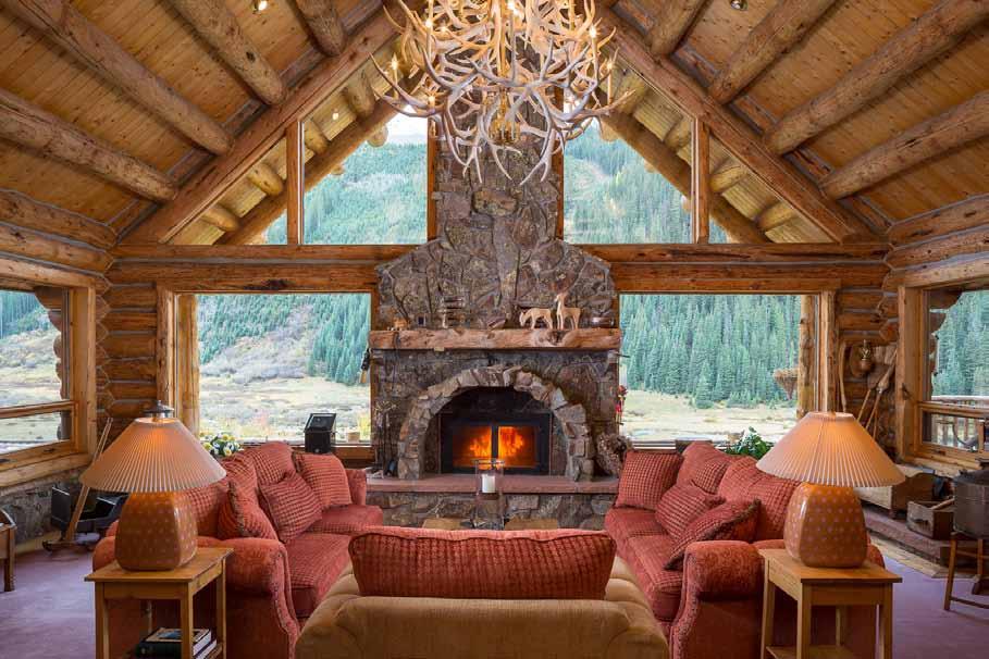 The warm and cozy log home features authentic lodge-style