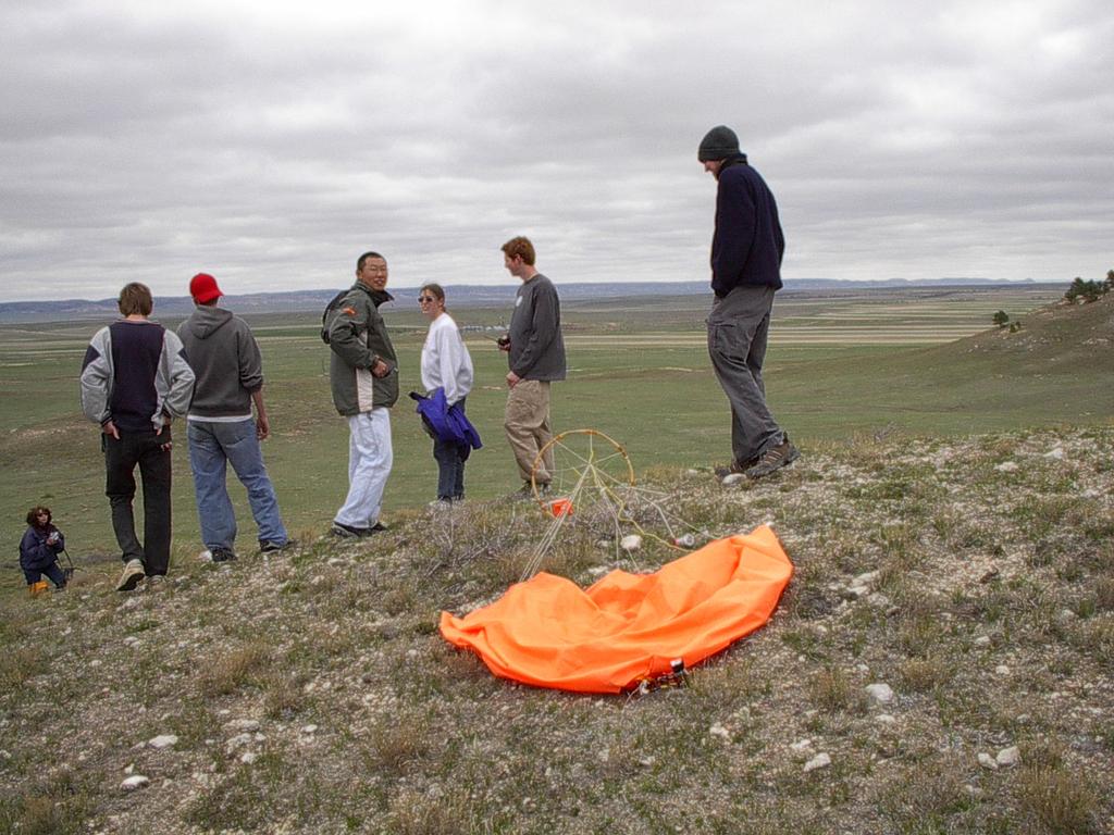 Upon reaching the landing site, a hike of one to four miles may occur due to limited road access and terrain conditions. The use of a radio locator device is usually needed to locate the balloon.