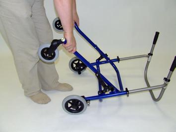 17 Take hold of the walker s base frame behind the front wheel s and lift it or tilt the walker onto the rear wheels. The anterior frame will fold in (18).