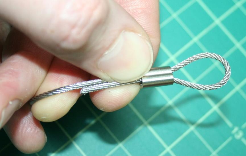 Using your pliers or crimping tool, crimp the Cable Crimp down onto the cabling so that the cable end