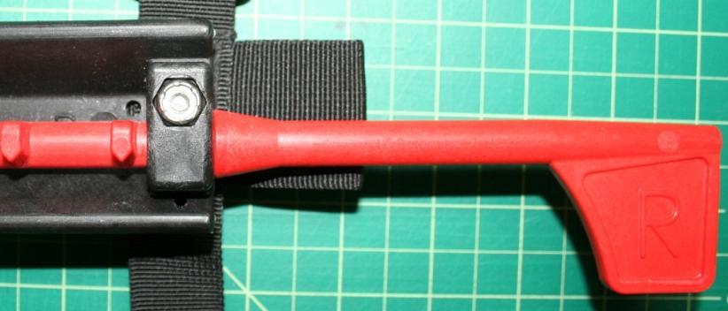 Starting with one adjustable webbing strap at a time, put 1 screw with washer through the Velcro opening of each webbing strap.