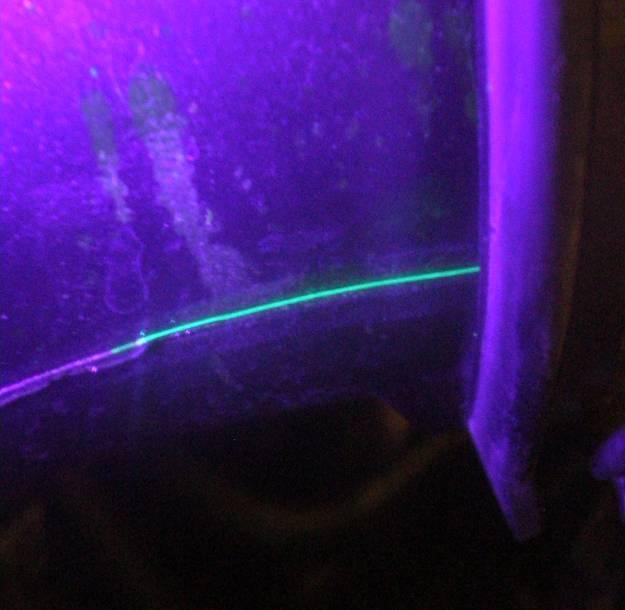 the exact location of a leak. Use the UV light provided to highlight the dye.