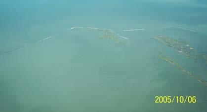 Figure 35. Aerial view of geotextile tubes protecting marsh restoration project in Galveston Island State Park. Summary Hurricane Rita made landfall near the border of Texas and Louisiana.