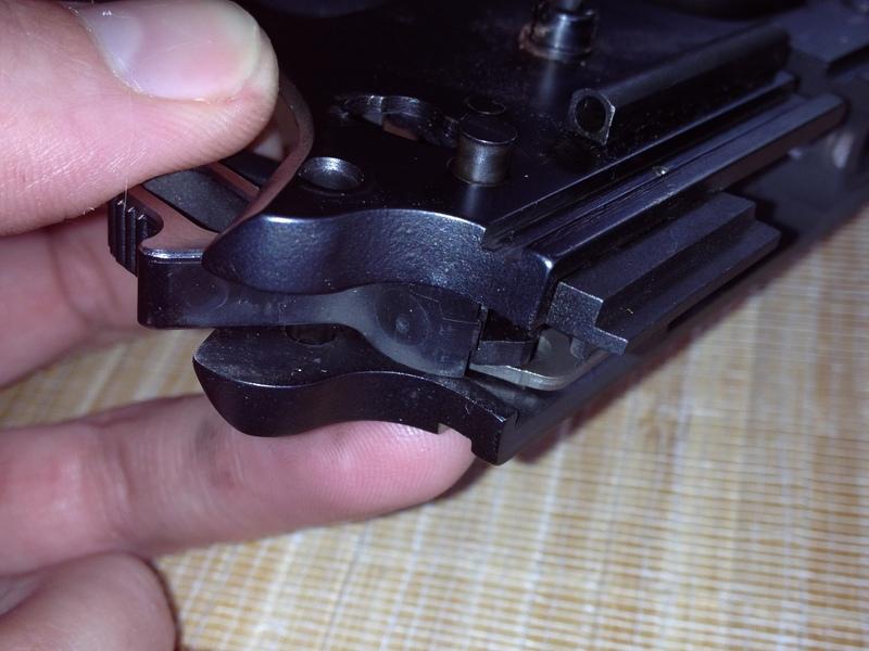 Step 12 Push up on the trigger pin to remove it.