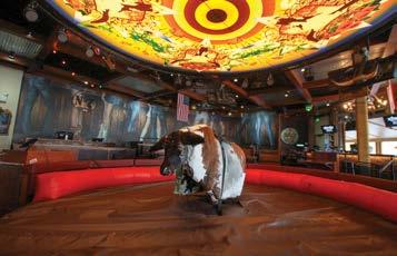 Featuring a mechanical bull, two full service bars and garage style patio doors that open to