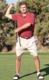 Right hand holds the club head and left hand holds the shaft.