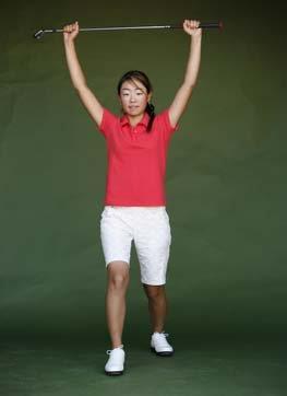 Standing Side Bend Place hands about shoulder width apart on golf club,