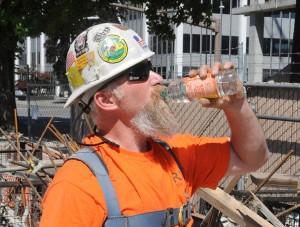 Kevin Mercer, a carpenter with Walsh Construction, always keeps a bottle of water in his tool belt.