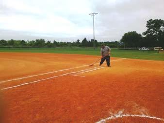 Services Department dragging the softball fields at the Ormond Beach Sports Complex in between games during a
