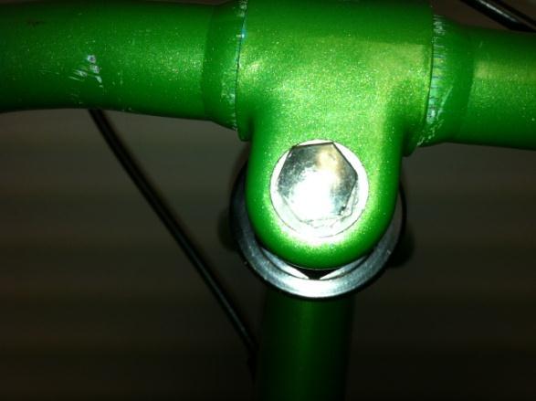 Tighten 12 mm bolt with provided wrench on top of stem until front wheel and
