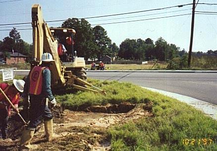 Above Left: Bore-Gard PVC pipe at a depth of 6 feet is being pulled beneath the active roadway. The tight transition and resultant bend radius was no problem for the strong joint design.