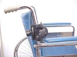 The jaw clamps can be opened to its widest position by pushing the movable jaw forward and outward (see diagram on right). Back of wheelchair Front of wheelchair 2.