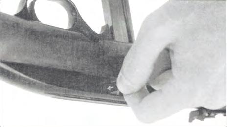 To release the bolt, pull the end of the operating handle to the rear and outward to release.