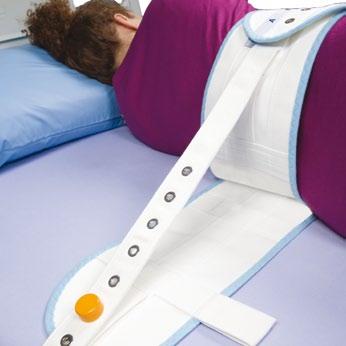 The lower part, with fixing bands and two tabs, has to be fixed to the bed or stretcher frame; the upper part has to be placed around the waist of the patient.