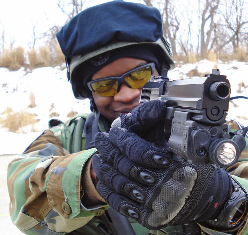 Rochester Police Department Emergency Task Force Officer Henry Favor test fires the MARK 23. Notice the Insight Technology LAM or Laser Aiming Module.