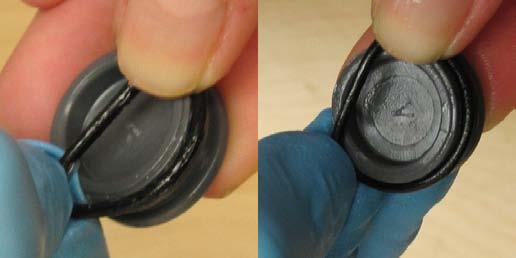 16. Ease O-ring onto battery cap - Starting at one side, gently ease O-ring over the battery cap 17.