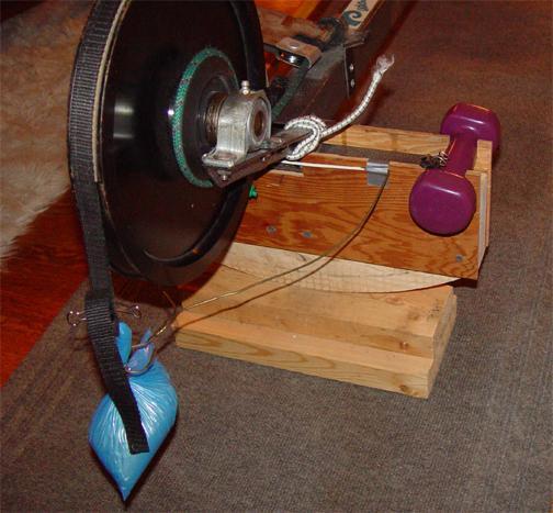 The Counter-Balance Weight Now that the paddling machine can lean side-to-side the off-center flywheel will tilt the machine. To counter that and make the machine level I added a 1 ½ pound (0.