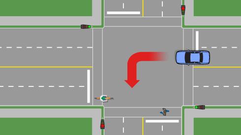 Cyclists, be on the lookout for vehicles that may turn wide at intersections.
