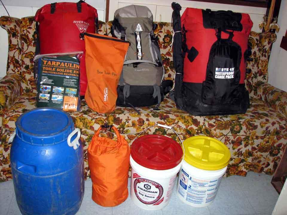 Gear for 2 persons / 9 days in September: L to R on couch 1) Red river pack - two sleeping pads, tent, misc. stuff, first aid kit, rope.