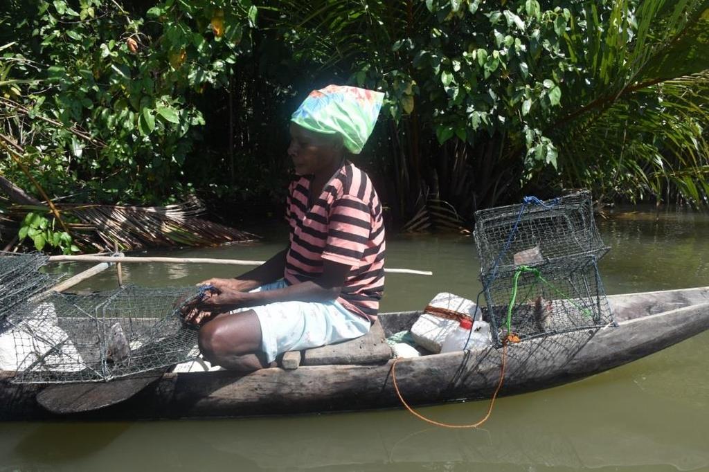 A mudcrab fisherwoman with all of her fishing gears. Photo credit: MDPI 6.