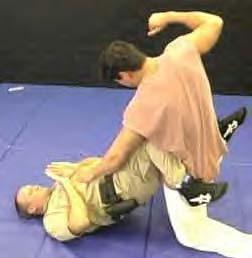 This grip is sometimes called a "Figure 4". to the same side which has the armlock.