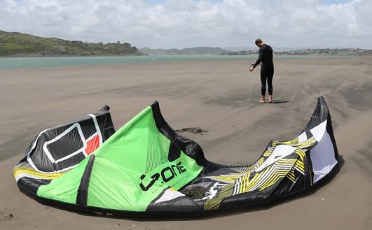 1 2 ATTACHING THE CONTROL LINES With the kite on the sand and leading