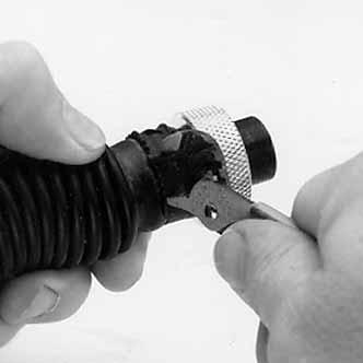 ULTRAVUE FACEPIECE REPAIR BREATHING TUBE OR INSERTS 1. Place a small screwdriver under the clamp and twist it to pry the clamp off. THREADED INSERT ON THE FACEPIECE END OF THE BREATHING TUBE 1.