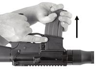 KEEP THE MUZZLE POINTED IN A SAFE DIRECTION AT ALL TIMES. Remove the magazine by pressing the magazine release button (see Fig. 10 or Fig.11 as applicable).