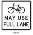 may be used on roadways where no bicycle lanes or adjacent shoulders usable by bicyclists are present and where travel lanes are too narrow for bicyclists and motor vehicles to operate side by side.