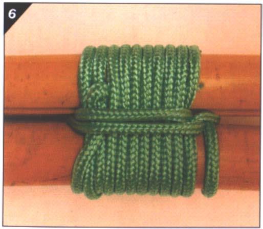 6. Pull tight to finish the round lashing with the poles parallel. Figure 23 Step 6 Note. From Pocket Guide to Knots and Splices (p. 185), by D. Pawson, 2001, 7.