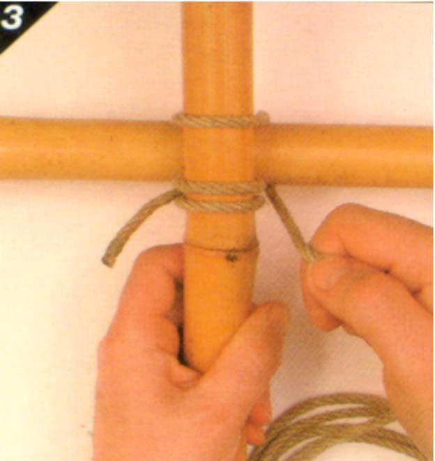 3. Bring the cord over the vertical pole and back behind the horizontal pole to the clove hitch.