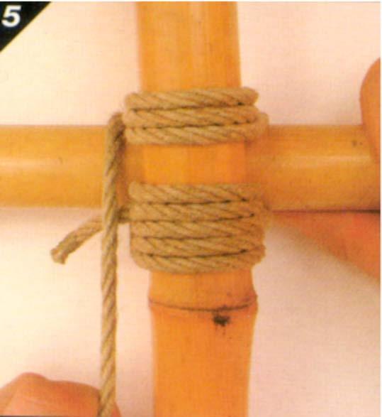 5. After passing the clove hitch, bring the cord around the horizontal pole from behind and start to wrap around the junction between the two poles.