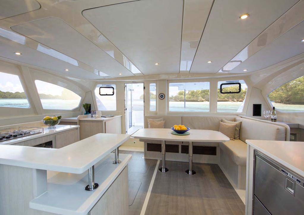 The ergonomic galley layout features soft curves and heat-resistant corian